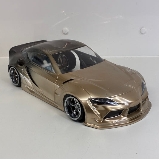 MST Toyota GR Supra (A90) Finished In An Elegant Champagne Gold/Bronze Metallic Paint